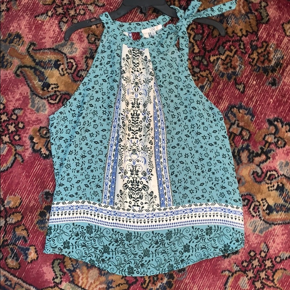 Pretty green print sleeveless blouse